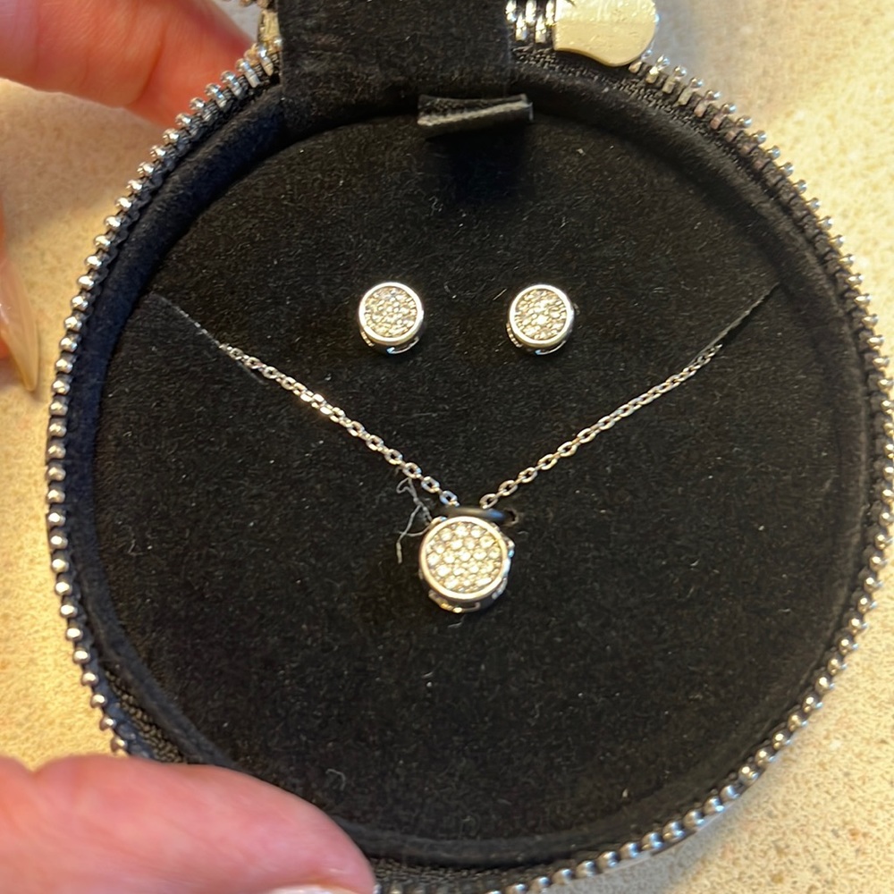 New necklace and matching earrings with tags. Silver with rhinestones.